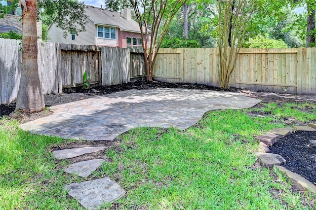 30 N Scribewood Cir, The Woodlands, TX 77382 - fenced backyard with a patio