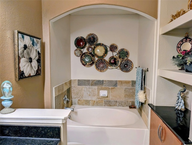 1901 Post Oak Blvd Unit 3101, Houston, TX 77056 - bathroom featuring a bath and a textured wall