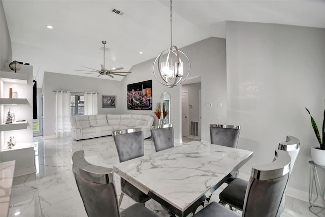 16806 Carbridge Dr, Houston, TX 77084 - dining area featuring ceiling fan, lofted ceiling, light marble finish flooring, a chandelier, and recessed lighting