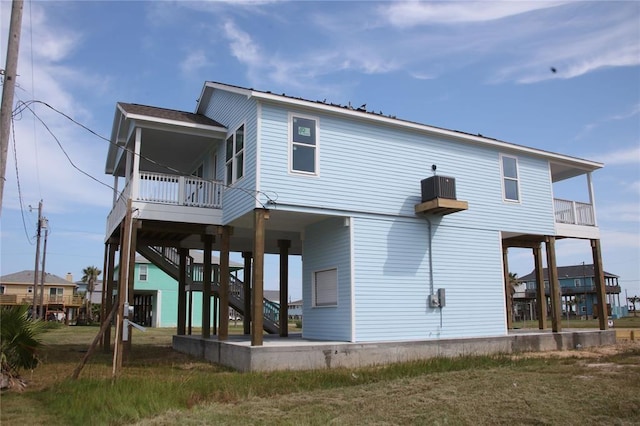 13214 Buccaneer Pkwy, Freeport, TX 77541 - back of property with stairway and a patio