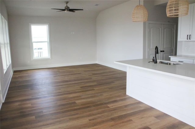 13214 Buccaneer Pkwy, Freeport, TX 77541 - unfurnished dining area featuring ceiling fan, dark wood-style floors, and lofted ceiling