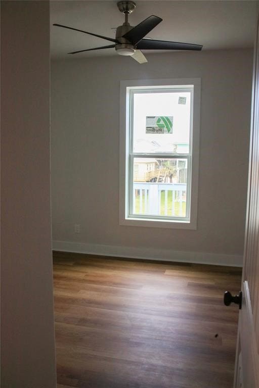 13214 Buccaneer Pkwy, Freeport, TX 77541 - spare room featuring a ceiling fan and wood finished floors