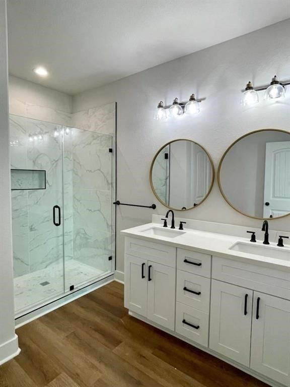 13214 Buccaneer Pkwy, Freeport, TX 77541 - full bath with a marble finish shower, double vanity, wood finished floors, and recessed lighting