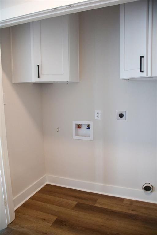 13214 Buccaneer Pkwy, Freeport, TX 77541 - laundry area with cabinet space, electric dryer hookup, dark wood finished floors, hookup for a washing machine, and gas dryer hookup