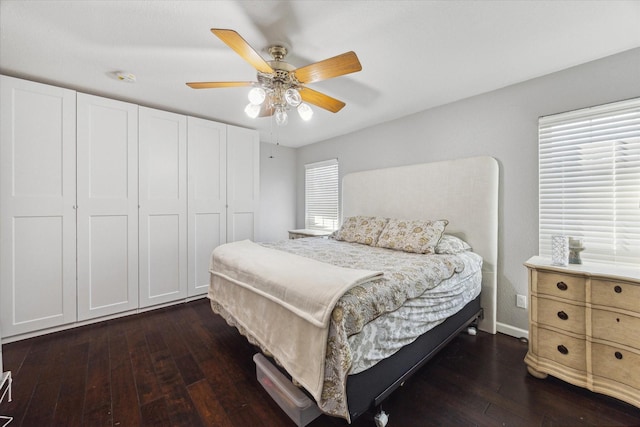 1880 White Oak Dr Unit 159, Houston, TX 77009 - bedroom with dark wood-style floors and a ceiling fan