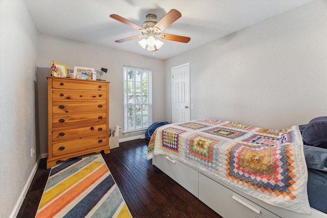 1880 White Oak Dr Unit 159, Houston, TX 77009 - bedroom featuring dark wood-style flooring and a ceiling fan