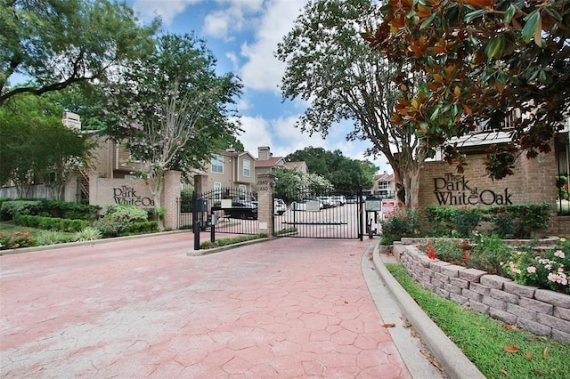 1880 White Oak Dr Unit 159, Houston, TX 77009 - gate featuring a residential view