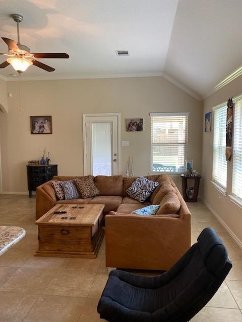 6727 Trinity Trail Ln, Richmond, TX 77469 - living area with light tile patterned floors, ceiling fan, vaulted ceiling, and crown molding