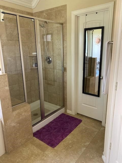 6727 Trinity Trail Ln, Richmond, TX 77469 - bathroom with a stall shower and ornamental molding