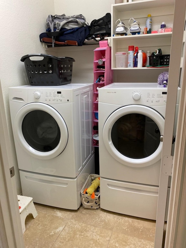 6727 Trinity Trail Ln, Richmond, TX 77469 - laundry room featuring washer and dryer and tile patterned floors