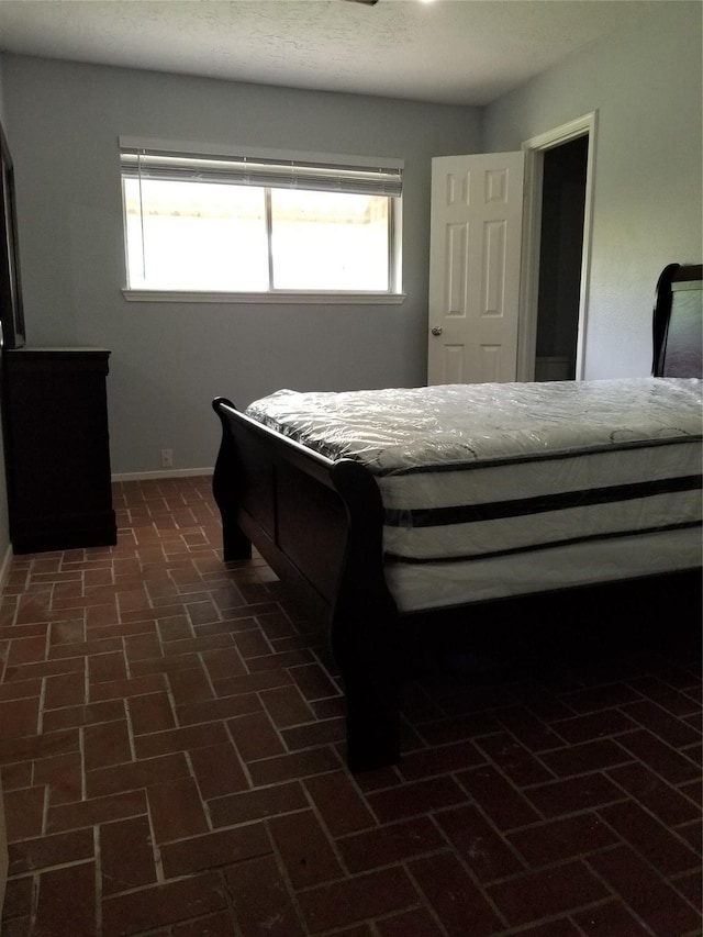 8806 Leader St, Houston, TX 77036 - bedroom with brick patterned floors and multiple windows