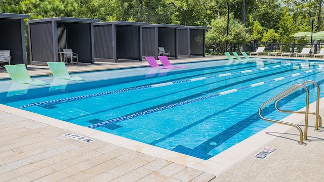 131 Evening Tide Ct, Conroe, TX 77318 - community pool with view of scattered trees