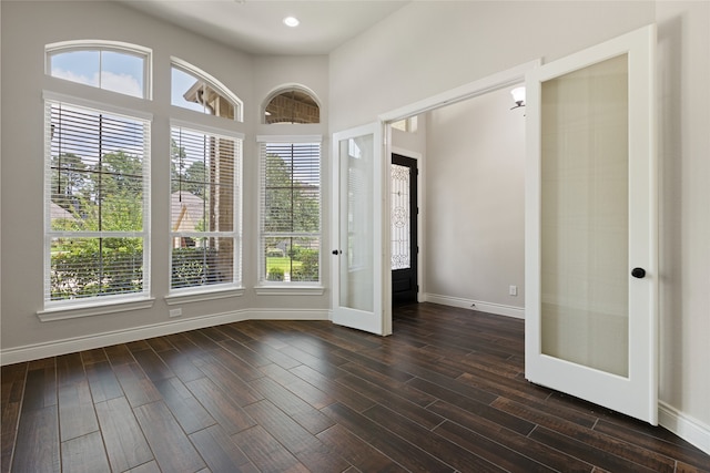 131 Evening Tide Ct, Conroe, TX 77318 - entrance foyer featuring dark wood-style floors and french doors