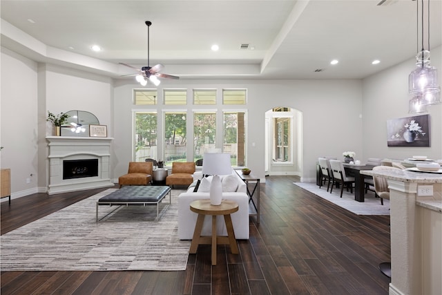 131 Evening Tide Ct, Conroe, TX 77318 - living room featuring a ceiling fan, dark wood-style flooring, a fireplace, and recessed lighting