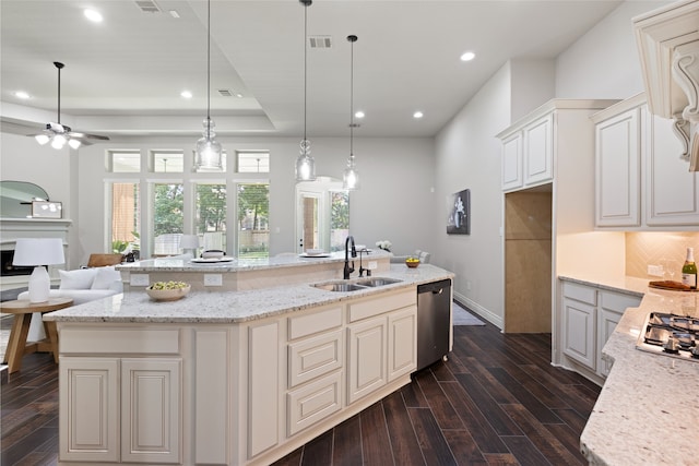 131 Evening Tide Ct, Conroe, TX 77318 - kitchen with dishwasher, open floor plan, dark wood-style flooring, recessed lighting, and backsplash