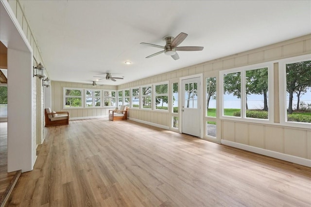 3533 Fm 563, Anahuac, TX 77514 - unfurnished sunroom featuring wood finished floors and a decorative wall