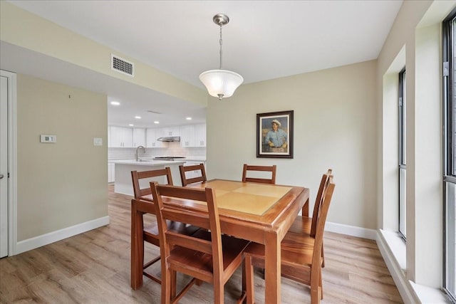 3533 Fm 563, Anahuac, TX 77514 - dining area with light wood-type flooring and recessed lighting