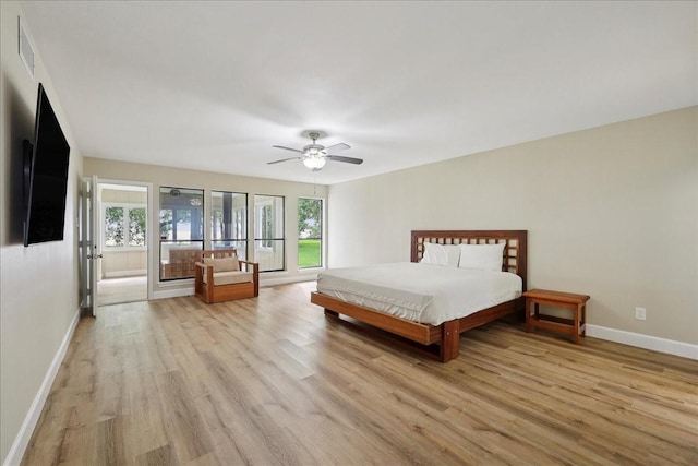 3533 Fm 563, Anahuac, TX 77514 - bedroom with light wood-type flooring and ceiling fan