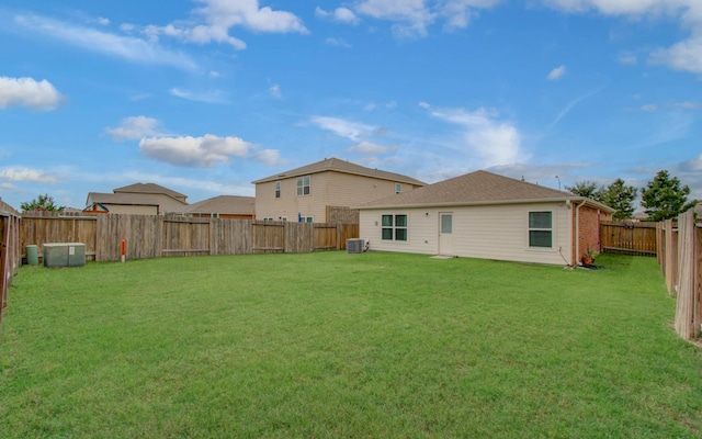 22418 Threefold Ridge Dr, Hockley, TX 77447 - rear view of house featuring a fenced backyard and brick siding