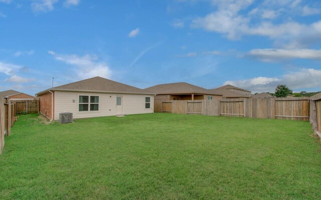 22418 Threefold Ridge Dr, Hockley, TX 77447 - rear view of house with a fenced backyard