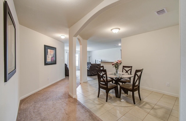 22418 Threefold Ridge Dr, Hockley, TX 77447 - dining area featuring arched walkways and light tile patterned floors