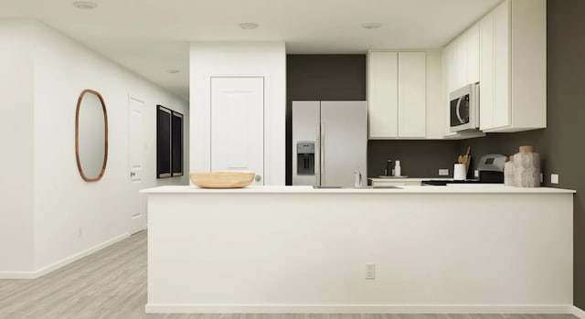 3013 Wild Dunes Dr, Katy, TX 77493 - kitchen featuring white fridge with ice dispenser, stove, light countertops, light wood-type flooring, and white cabinets