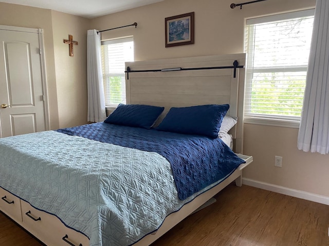 1025 14th St, Dickinson, TX 77539 - bedroom featuring wood finished floors and baseboards