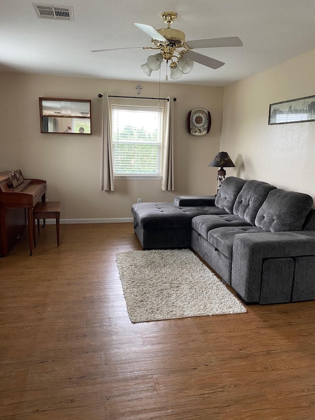 1025 14th St, Dickinson, TX 77539 - living area with ceiling fan and wood finished floors
