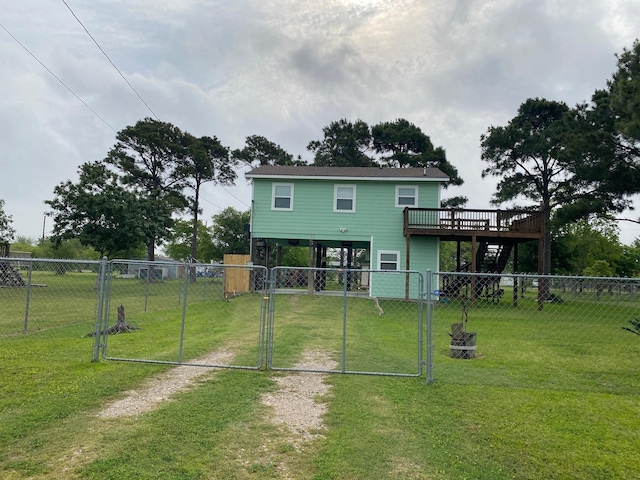 1025 14th St, Dickinson, TX 77539 - rear view of house featuring a gate, a wooden deck, stairway, and driveway
