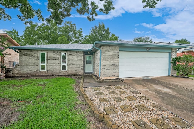 5130 Porter Ridge Dr, Houston, TX 77053 - ranch-style house featuring brick siding, a garage, concrete driveway, a front lawn, and a shingled roof