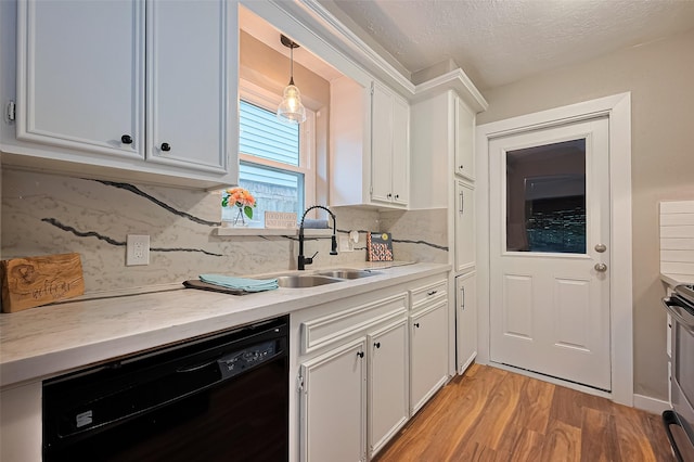 5130 Porter Ridge Dr, Houston, TX 77053 - kitchen featuring dishwasher, light countertops, light wood-style floors, white cabinetry, and decorative backsplash