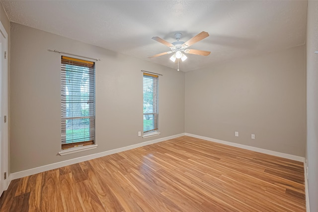 5130 Porter Ridge Dr, Houston, TX 77053 - spare room with light wood-type flooring, a ceiling fan, and a textured ceiling