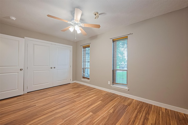 5130 Porter Ridge Dr, Houston, TX 77053 - unfurnished bedroom with light wood finished floors, a closet, and ceiling fan