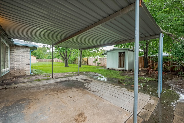 5130 Porter Ridge Dr, Houston, TX 77053 - fenced backyard featuring a storage shed and a patio