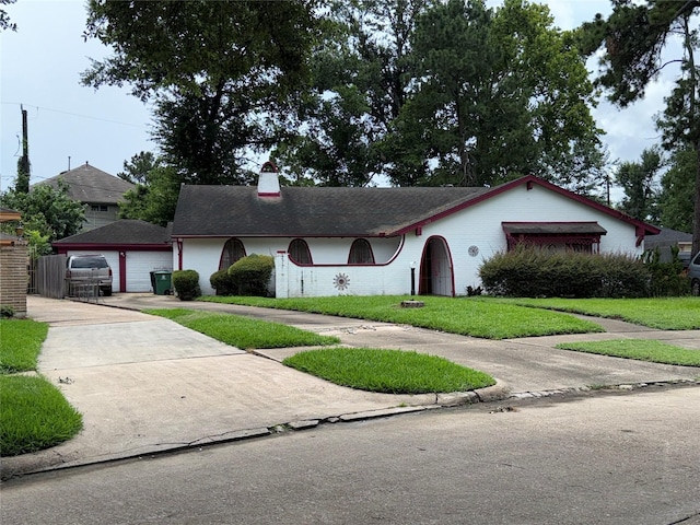 1151 Creekmont Dr, Houston, TX 77091 - ranch-style home with a front yard, a detached garage, and a chimney