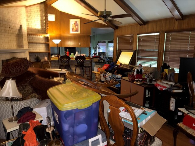 1151 Creekmont Dr, Houston, TX 77091 - living area with wood finished floors, a ceiling fan, and wooden walls