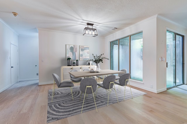 2308 Nantucket Dr Unit B, Houston, TX 77057 - dining space with wood finished floors, ornamental molding, and a textured ceiling
