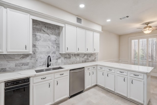 2308 Nantucket Dr Unit B, Houston, TX 77057 - kitchen featuring dishwasher, a peninsula, white cabinets, and recessed lighting