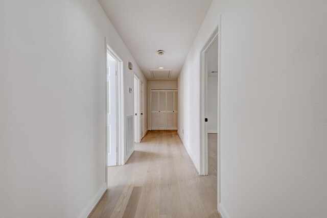 2308 Nantucket Dr Unit B, Houston, TX 77057 - corridor featuring light wood-style flooring and attic access