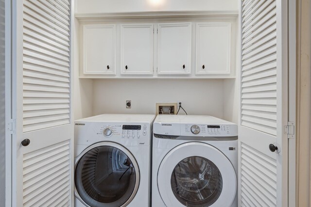 2308 Nantucket Dr Unit B, Houston, TX 77057 - laundry area with washing machine and dryer and cabinet space