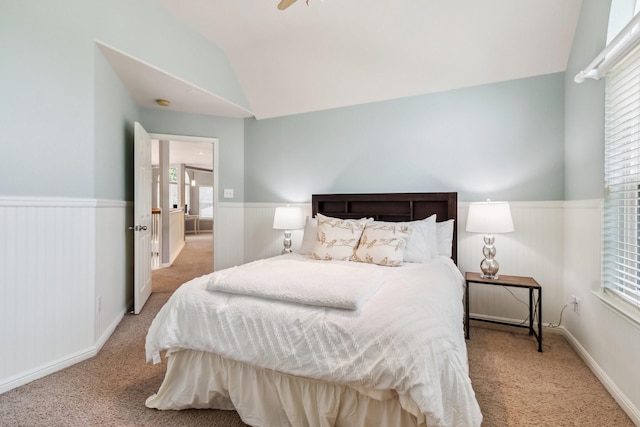 13518 Via Chianti Ln, Cypress, TX 77429 - carpeted bedroom with lofted ceiling, a wainscoted wall, and multiple windows