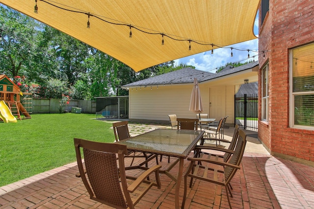 13518 Via Chianti Ln, Cypress, TX 77429 - fenced backyard featuring a patio, outdoor dining area, a playground, and a trampoline