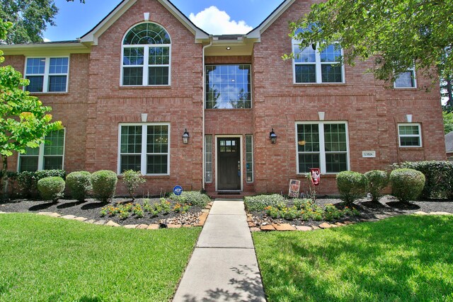 13518 Via Chianti Ln, Cypress, TX 77429 - view of front facade featuring a front yard and brick siding