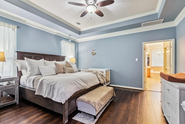 13518 Via Chianti Ln, Cypress, TX 77429 - bedroom with a raised ceiling, hardwood / wood-style flooring, crown molding, ceiling fan, and connected bathroom