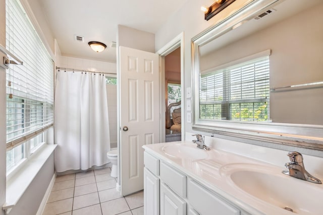 13518 Via Chianti Ln, Cypress, TX 77429 - full bathroom with plenty of natural light, tile patterned flooring, double vanity, and a shower with shower curtain