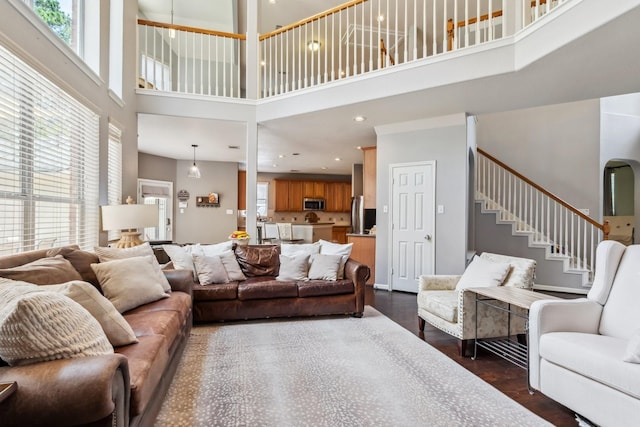 13518 Via Chianti Ln, Cypress, TX 77429 - living area featuring a towering ceiling, dark wood finished floors, stairs, and recessed lighting