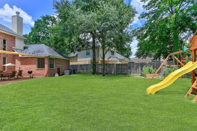 13518 Via Chianti Ln, Cypress, TX 77429 - fenced backyard with a playground and a patio area