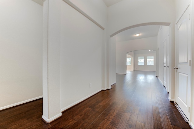 24014 Bluestem Ridge Ct, Katy, TX 77493 - hall featuring arched walkways and dark wood-type flooring
