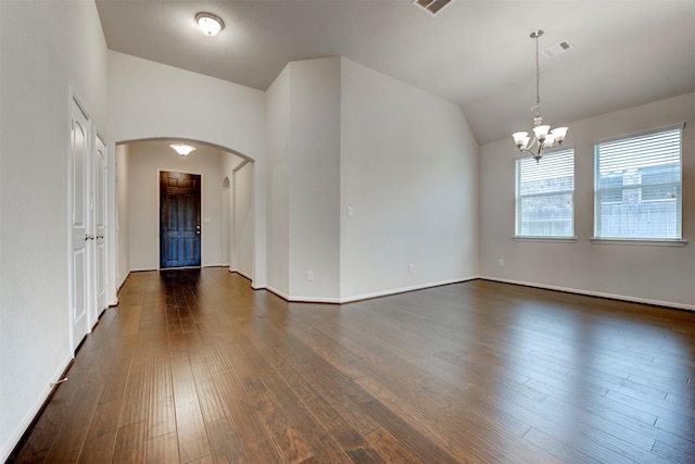 24014 Bluestem Ridge Ct, Katy, TX 77493 - unfurnished room featuring arched walkways, a chandelier, dark wood-style floors, and vaulted ceiling