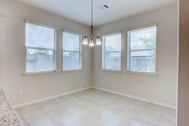 24014 Bluestem Ridge Ct, Katy, TX 77493 - unfurnished dining area featuring a chandelier and baseboards